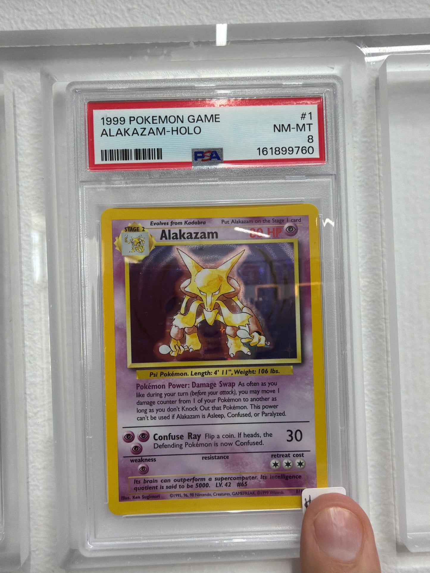 1999 POKEMON GAME ALAKAZAM HOLO #1 PSA NEAR MINT 8